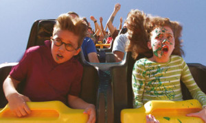 Kids-ride-a-rollercoaster